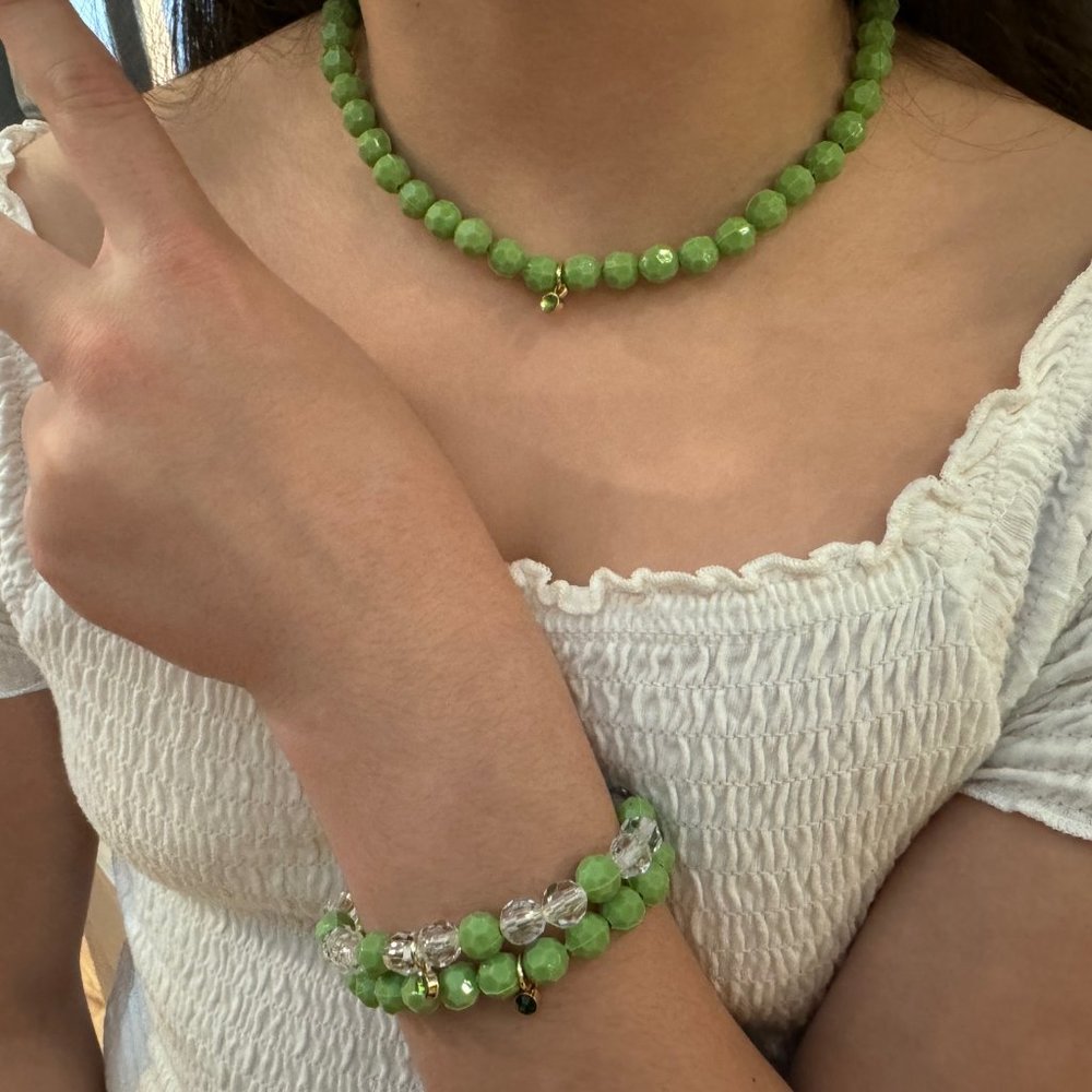 Lime-green beaded necklace with two matching bracelets.